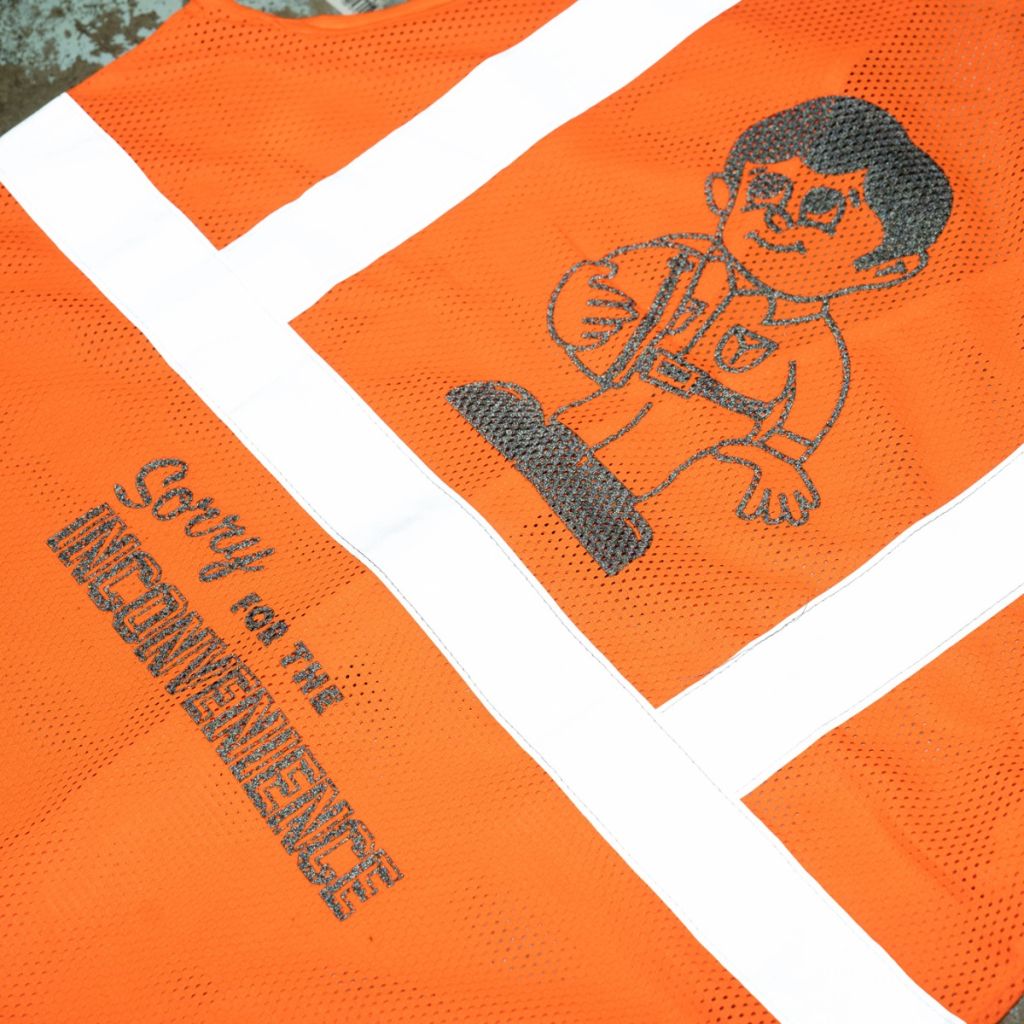 *THE INCONVENIENCE STORE* safety vest (orange)